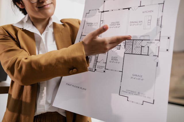 realtor presenting a floor plan